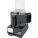 A black Waring food processor with a clear lid.