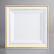 A white square plate with gold trim.