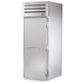 A silver True Spec Series roll-in freezer with a white door and silver handles.