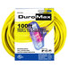 A yellow DuroMax 100' heavy-duty triple tap extension power cord.