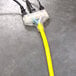 A yellow DuroMax extension cord with three plugs.