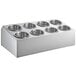 A stainless steel flatware organizer with perforated stainless steel cylinders.