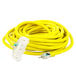 A close up of a yellow DuroMax extension cord with a white plug.