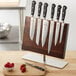 A Mercer Culinary Renaissance knife set on a wooden stand.