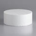 A white cylinder on a gray surface.
