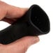 A hand using a black San Jamar silicone handle holder.