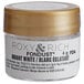 A small container of Roxy & Rich Bright White Fondust with a gold lid and label.