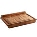 a wooden cutting board with two handles