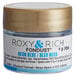 A small container of Roxy & Rich Neon Blue Fondust food color with a label.