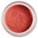 a jar of pink powder