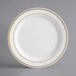 a white plate with gold trim