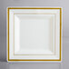 A white square plate with gold trim.