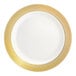 A round bone or ivory plastic plate with a gold lattice design around the rim.