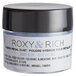 A white container of Roxy & Rich Baby Blue petal dust with a black lid.