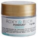 A small container of Roxy & Rich Turquoise Fondust powder with a gold lid and label.