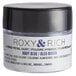 A container of Roxy & Rich Navy Blue Petal Dust with a black lid.