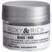 A silver container of Roxy & Rich black sparkle dust with a white label.