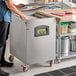 A stainless steel VacMaster VP545 floor model chamber vacuum packaging machine with two 20-inch seal bars on red caster wheels.