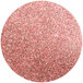 A pink circle with Ruby Lustre Dust and glitter.