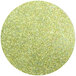 A round green object with a glittery surface.