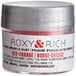 A container of Roxy & Rich red-orange sparkle dust powder.