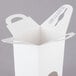 A white candy box with handle.