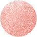 A pink circle with white specks of sparkle.