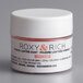 A white container of Roxy & Rich Magnolia Lustre Dust with a white lid.