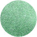 A circle of emerald green lustre dust with green glitter.