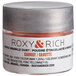 A jar of Roxy & Rich Carrot Sparkle Dust filled with orange powder.