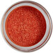 A jar of Roxy & Rich Carrot Sparkle Dust, glittery orange powder.