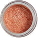 A jar of pink mineral powder with glitter on the label.
