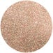 A circle of pink mahogany lustre dust with gold shimmer.