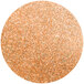 A round circle of orange and white glitter.