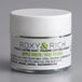 A white container of Roxy & Rich apple green tinted powder with a white lid.