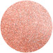 A round circle of pink and silver glitter.