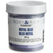 A container of Roxy & Rich Royal Blue Fondust food coloring.