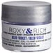 A silver Roxy & Rich container of blue violet powder dust.