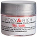 A silver jar of Roxy & Rich Coral Sparkle Dust with a white label.