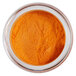 a bowl of orange powder