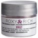 A small silver container of Roxy & Rich violet powder with a white label.