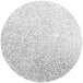 A close-up of a round silver glittery surface.