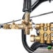 The gold metal Simpson pressure washer hose.