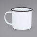 A Crow Canyon Home white enamel mug with black rim.