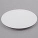 A white Wilton cake separator plate with a circular rim.