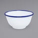 A white bowl with blue rim.