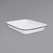 A white rectangular pan with black rim.