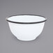A white Crow Canyon Home enamelware bowl with black rim.
