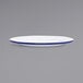 A white Crow Canyon Home enamelware plate with a blue rim.