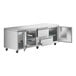 A stainless steel Avantco undercounter refrigerator with open doors.